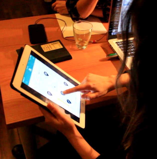 A participant operates a mobile-app prototype during a user test