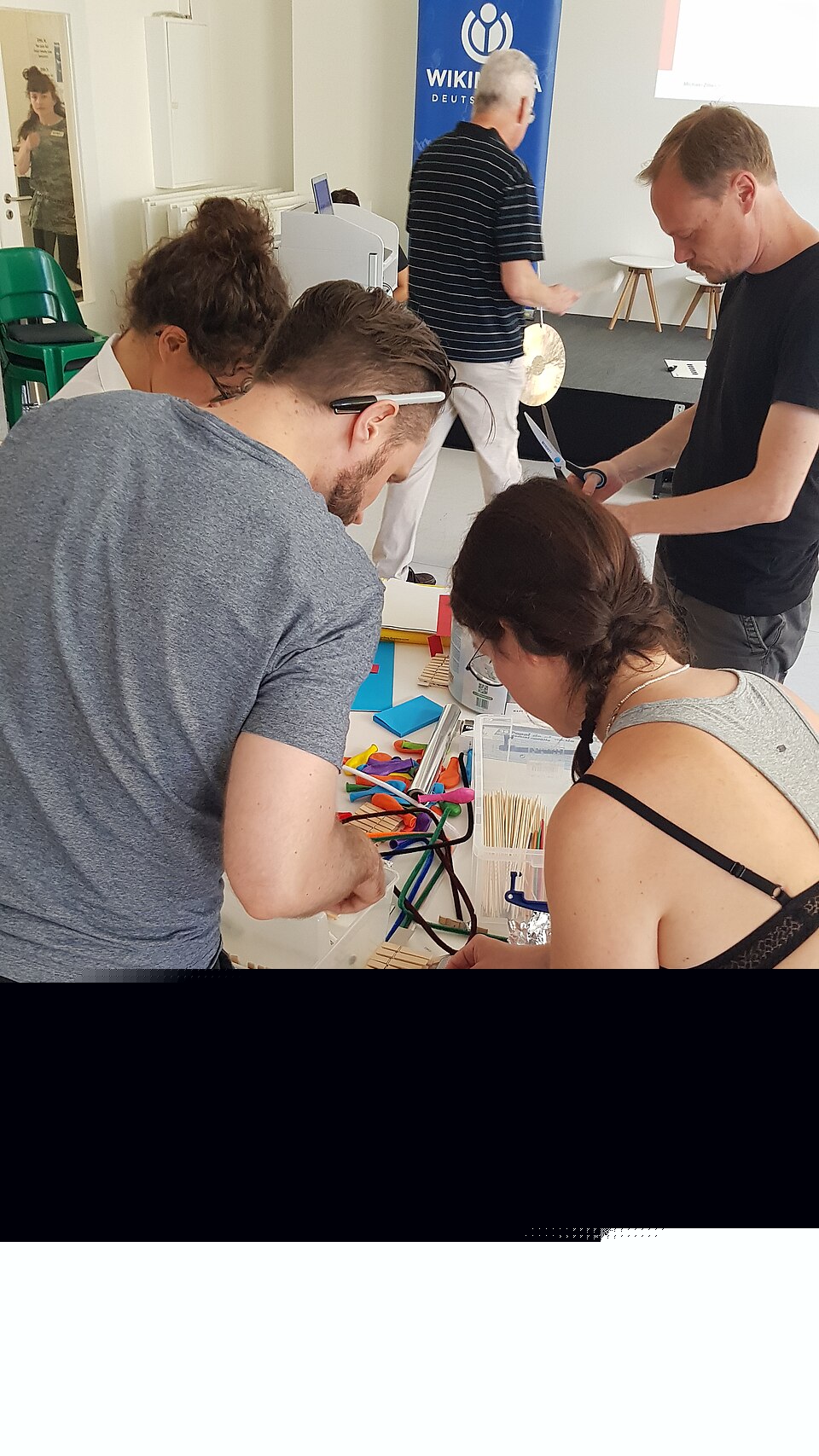 Participants at a Wikimedia Deutschland design-thinking workshop making solution ideas visible through hands-on group work